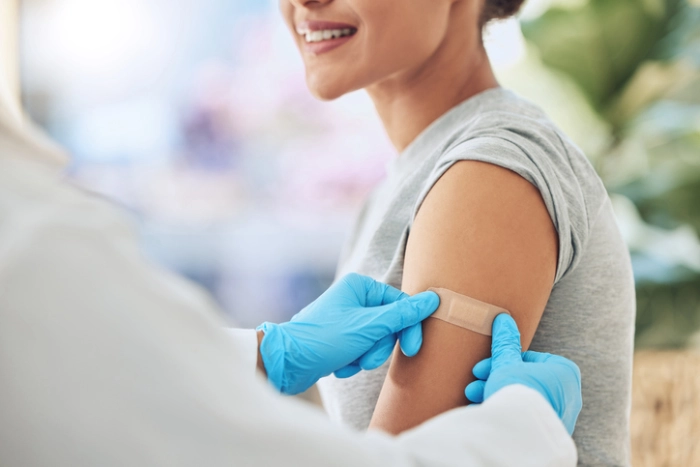 Woman receiving an immunization.