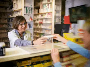 Traditional Pharmacy with Pharmacist and Patient
